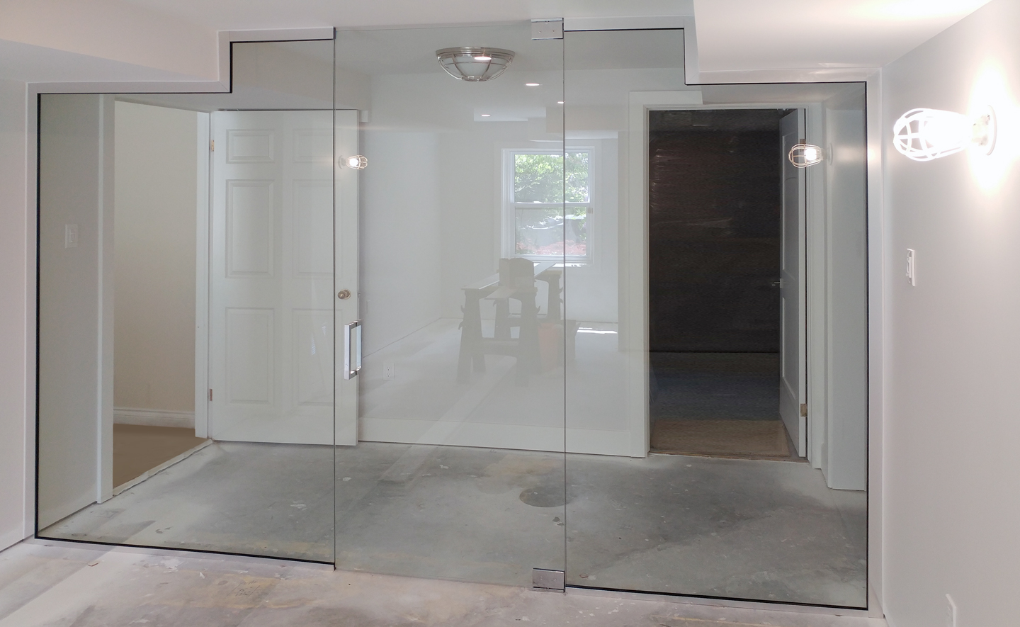 Glass walls with a glass door in a home